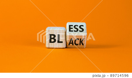 Bless black symbol. Turned a cube and changed the word 'black' to 'bless'. Beautiful orange background. Bless black concept. Copy space. Bless black symbol. Turned a cube and changed the word 'black' to 'bless'. Beautiful orange background. Bless black concept. Copy space. 89714596