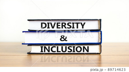 D and I, Diversity and inclusion symbol. Concept words D and I, diversity and inclusion on books on beautiful wooden table white background. Business, D and I, diversity and inclusion concept. 89714623