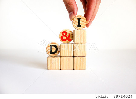 D and I, Diversity and inclusion symbol. Concept words D and I, diversity and inclusion on wooden circles on beautiful white background. Business, D and I, diversity and inclusion concept. D and I, Diversity and inclusion symbol. Concept words D and I, diversity and inclusion on wooden circles on beautiful white background. Business, D and I, diversity and inclusion concept. 89714624