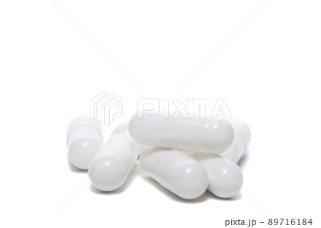 white pills an pill bottle on white background white pills an pill bottle on white background 89716184