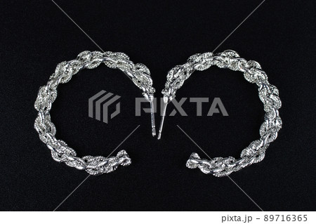 Jewelry earrings and costume jewelry on a black background Jewelry earrings and costume jewelry on a black background 89716365