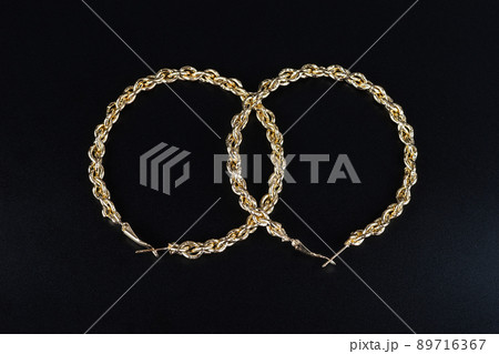 Jewelry earrings and costume jewelry on a black background Jewelry earrings and costume jewelry on a black background 89716367