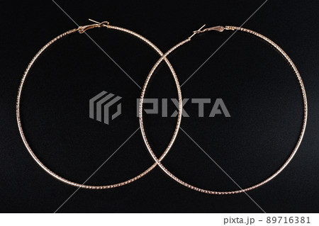 Jewelry earrings and costume jewelry on a black background Jewelry earrings and costume jewelry on a black background 89716381