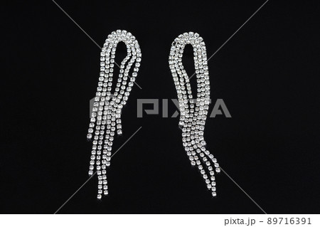 Jewelry earrings and costume jewelry on a black background Jewelry earrings and costume jewelry on a black background 89716391
