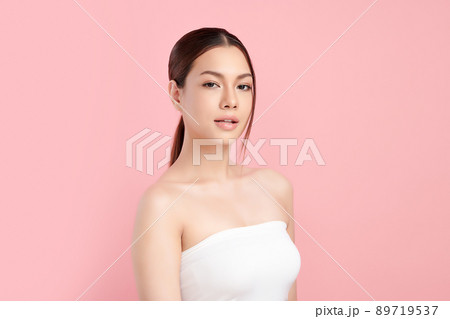Beautiful young asian woman with clean fresh skin on pink background, Face care, Facial treatment, 89719537