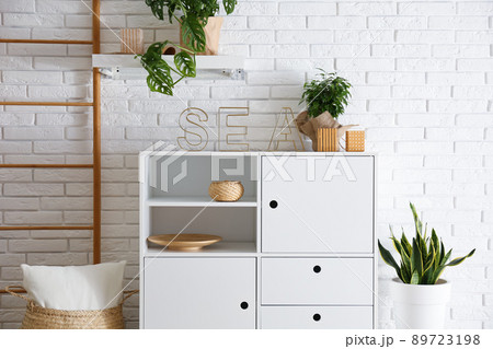 Chest of drawers in stylish room interior Chest of drawers in stylish room interior 89723198