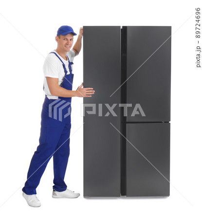 Professional worker carrying refrigerator on white background Professional worker carrying refrigerator on white background 89724696