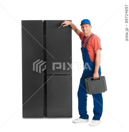 Male technician with tool box near refrigerator on white background Male technician with tool box near refrigerator on white background 89724697