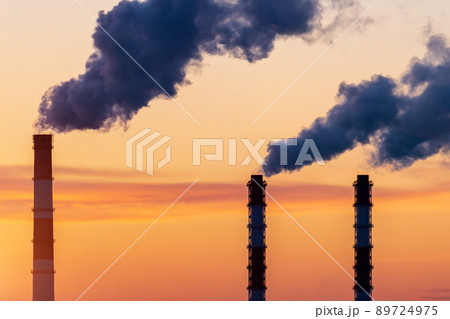 Factory chimneys emit water vapor. Concept air pollution, environmental problems, air emissions. Factory chimneys emit water vapor. Concept air pollution, environmental problems, air emissions. 89724975