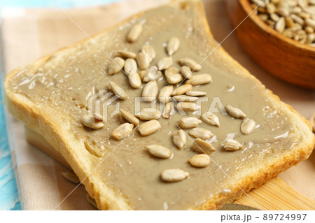 Organic toast bread with healthy organic sunflower seed butter. Organic toast bread with healthy organic sunflower seed butter. 89724997