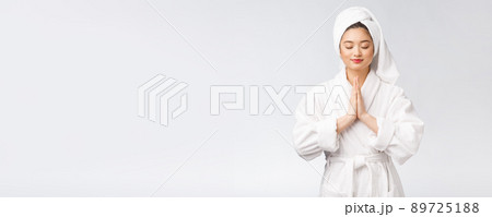Beautiful women take care of skin health holding hand praying. Beautiful girl on white background. Beautiful women take care of skin health holding hand praying. Beautiful girl on white background. 89725188
