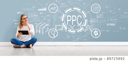 PPC - Pay per click concept with young woman using a tablet PPC - Pay per click concept with young woman using a tablet 89725692