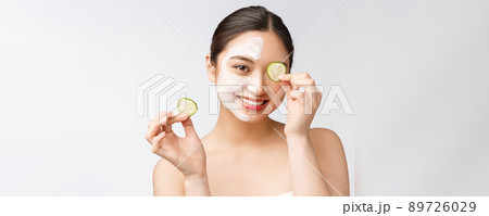Beauty young asian women skin care image with cucumber on white background studio Beauty young asian women skin care image with cucumber on white background studio 89726029