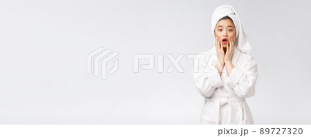 Spa skincare beauty Asian woman drying hair with towel on head after shower treatment. Beautiful multiracial young girl touching soft skin Spa skincare beauty Asian woman drying hair with towel on head after shower treatment. Beautiful multiracial young girl touching soft skin 89727320