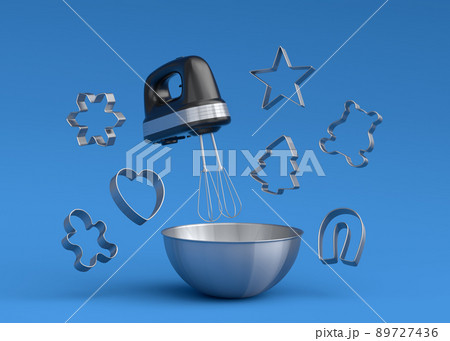 Metal bowl with electric mixer and cookie cutters on blue background 89727436