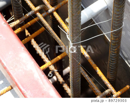 SELANGOR, MALAYSIA -MAY 3, 2022: Steel reinforcement bars for reinforced concrete construction have started to rust after being exposed to weather and water vapor. It can affect rebar if left untreate SELANGOR, MALAYSIA -MAY 3, 2022: Steel reinforcement bars for reinforced concrete construction have started to rust after being exposed to weather and water vapor. It can affect rebar if left untreate 89729303
