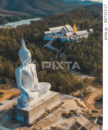 Wat Phrathat Pu Jae buddha and Huai Mae Toek lake in Phrae province, Thailand Wat Phrathat Pu Jae buddha and Huai Mae Toek lake in Phrae province, Thailand 89732517