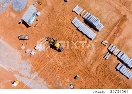 Large new concrete circular pipes lying down for the construction of sewerage system 89732562