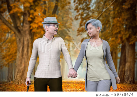 紅葉の並木道を、杖をついた老人と老女が仲良く笑顔で手をつないで歩いている 紅葉の並木道を、杖をついた老人と老女が仲良く笑顔で手をつないで歩いている 89738474
