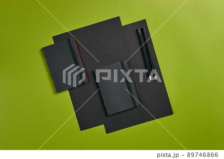 Top view in focus with different office equipment, supplies, stationery. Green background with copy space. Education, workplace concept. Close-up. Top view in focus with different office equipment, supplies, stationery. Green background with copy space. Education, workplace concept. Close-up. 89746866