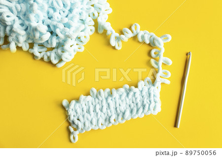 Soft yarn, delicate blue yarn. Handmade knitting as a hobby. Soft yarn, delicate blue yarn. Handmade knitting as a hobby. 89750056