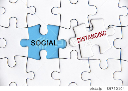 Social distancing text on Jigsaw Puzzle. Pandemic and outbreak concept. 89750104