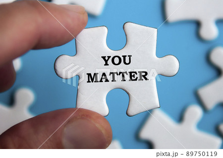 Motivational text on jigsaw puzzle with blue background - You matter. Motivational concept. Motivational text on jigsaw puzzle with blue background - You matter. Motivational concept. 89750119
