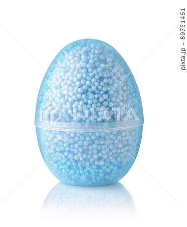 Front view of transparent egg container of blue modelling foam beads Front view of transparent egg container of blue modelling foam beads 89751461