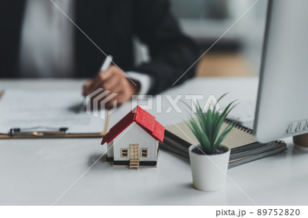 Real estate concept. Business woman sign in agreement contract. 89752820