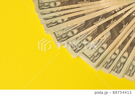 Big amount of old twenty dollar bills on yellow background. Money earnings, payday or tax paying period 89754413
