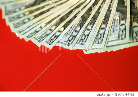 Big amount of old twenty dollar bills on bright red background. Money earnings, payday or tax paying period Big amount of old twenty dollar bills on bright red background. Money earnings, payday or tax paying period 89754442