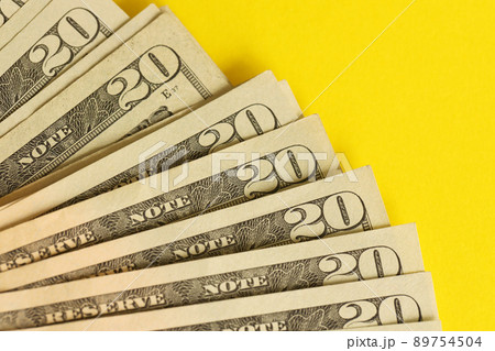 Big amount of old twenty dollar bills on golden background. Money earnings, payday or tax paying period 89754504