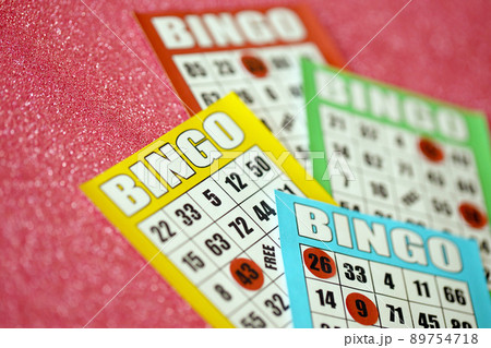 Many colorful bingo boards or playing cards for winning chips. Classic US or canadian five to five bingo cards on bright background 89754718