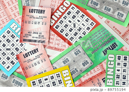 Many used lottery tickets, bills with numbers and bingo playing boards in big pile. Gambling and lottery paper stuff Many used lottery tickets, bills with numbers and bingo playing boards in big pile. Gambling and lottery paper stuff 89755194