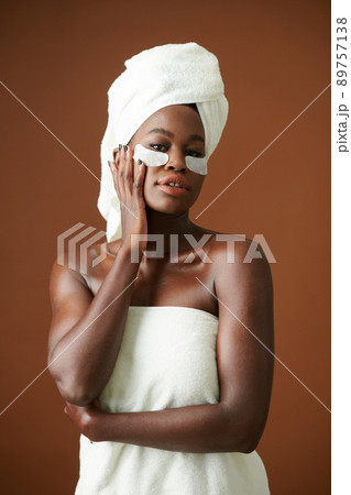 Woman Applying Hydrating Patches 89757138