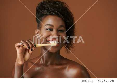 Excited Woman Brushing Teeth 89757176