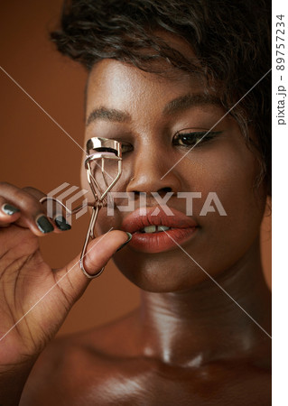 Black Woman Curling Lashes Black Woman Curling Lashes 89757234