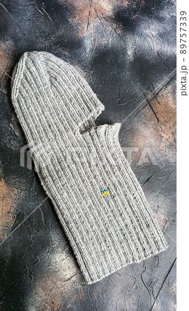 Handmade balaclava with Ukrainian symbols. Knitted from gray and green threads. Warms, reliably saves from the cold. 89757339