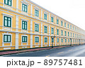 Yellow building with green window in vintage style on day with clear sky 89757481
