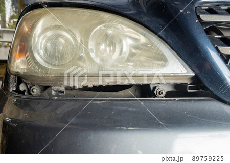 Dirty headlamp of a car Dirty headlamp of a car 89759225