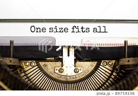 One size fits all symbol. Concept words One size fits all typed on retro typewriter. Beautiful white background. One size fits all business concept. Copy space. 89759336