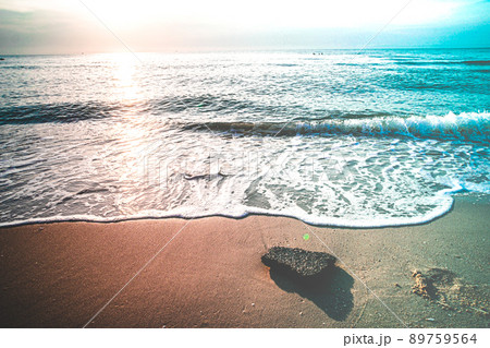 Soft Blue Waves on the beach at the summer time. sea beach blue sky sand sun daylight relaxation landscape viewpoint. The color of the water and beautifully bright clear water. Soft Blue Waves on the beach at the summer time. sea beach blue sky sand sun daylight relaxation landscape viewpoint. The color of the water and beautifully bright clear water. 89759564