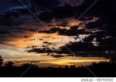 Evening sky sunset. big puffy cumulus and long stratus clouds. sky background with clouds Evening sky sunset. big puffy cumulus and long stratus clouds. sky background with clouds 89759565