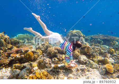 Child snorkeling. Kids underwater. Beach and sea. 89760932