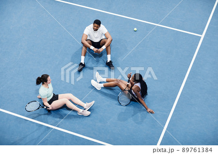 Team Relaxing at Tennis Court Team Relaxing at Tennis Court 89761384