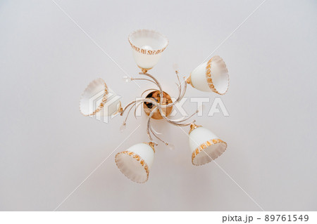 classic ceiling lamp with white lampshades with gold decor. classic ceiling lamp with white lampshades with gold decor. 89761549