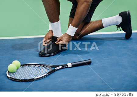 Tennis Player Tying Sports Shoes Tennis Player Tying Sports Shoes 89761588