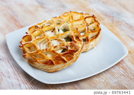 Image of fresh pastries from goat cheese and spinach Image of fresh pastries from goat cheese and spinach 89763441