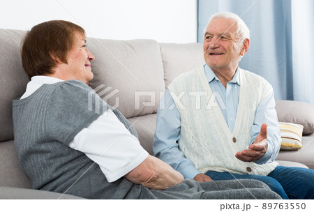Elderly couple warmly talk 89763550