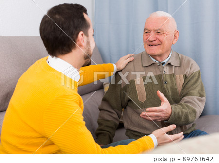 Old father and son friendly conversation Old father and son friendly conversation 89763642